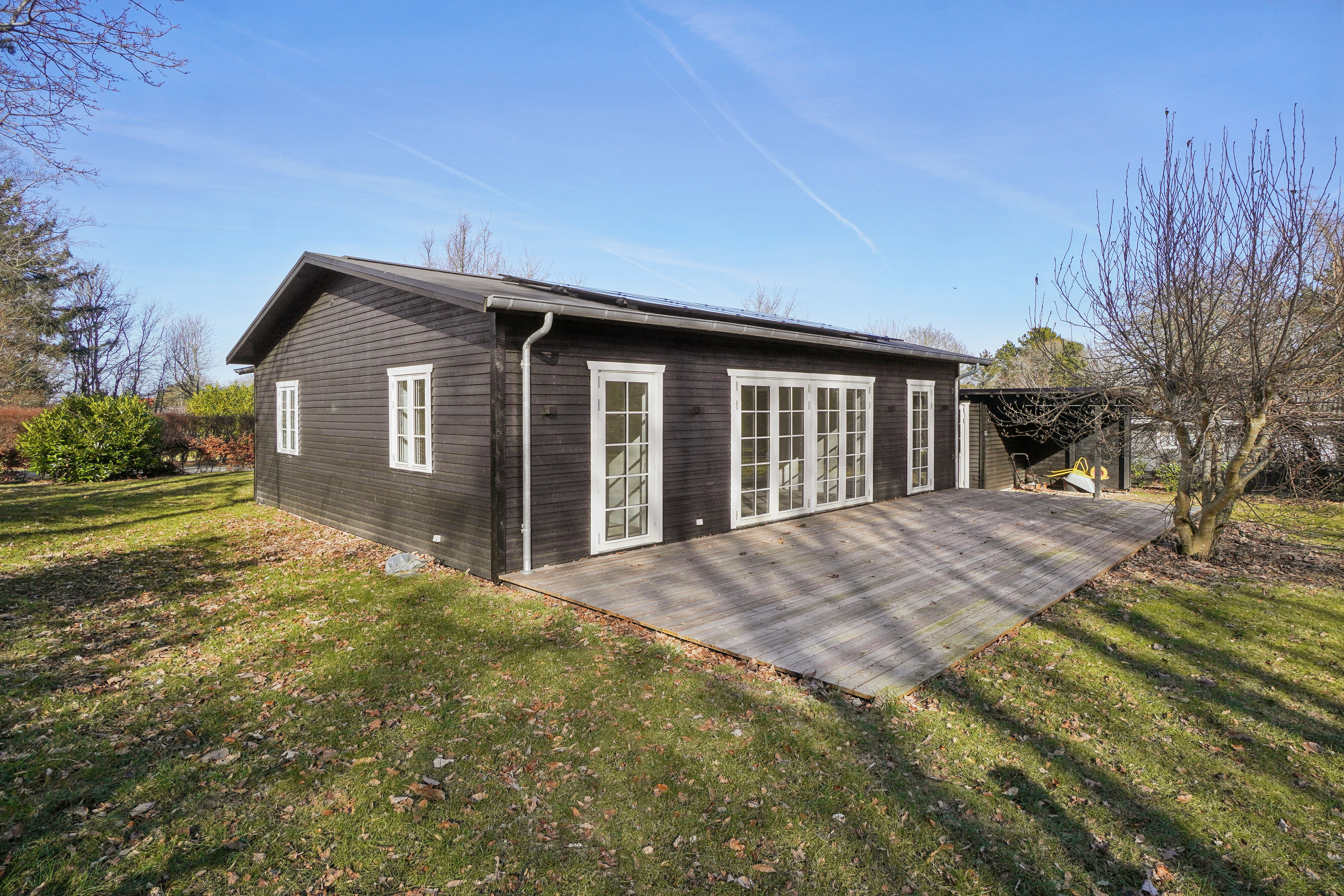 Fremhævet set fra haven billede i fuldskærmstilstand. Billede af Hans Kurtsvej 24, Evetofte, 3370 Melby