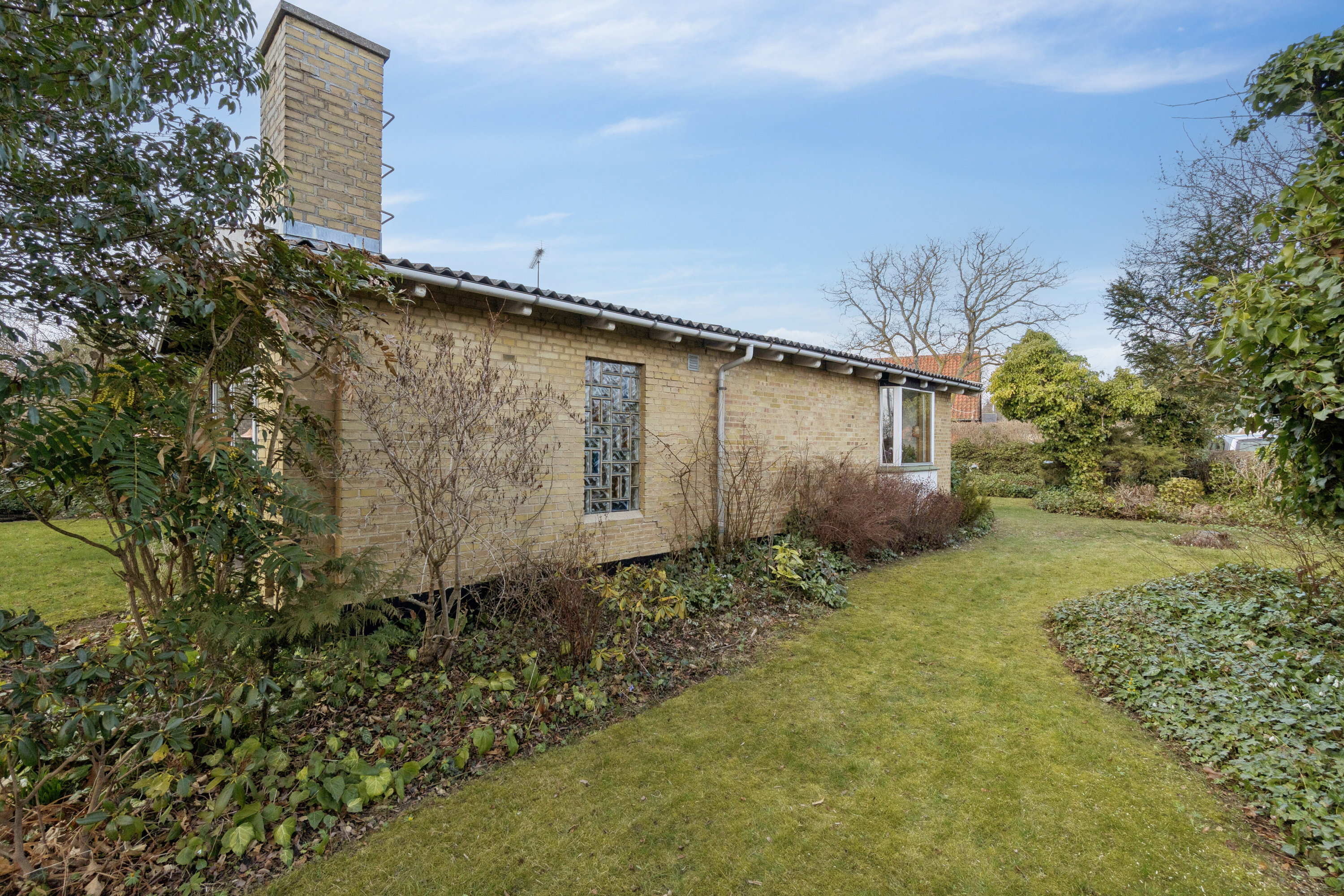 Fremhævet set fra haven billede i fuldskærmstilstand. Billede af Sandflugtsvej 24, 3700 Rønne