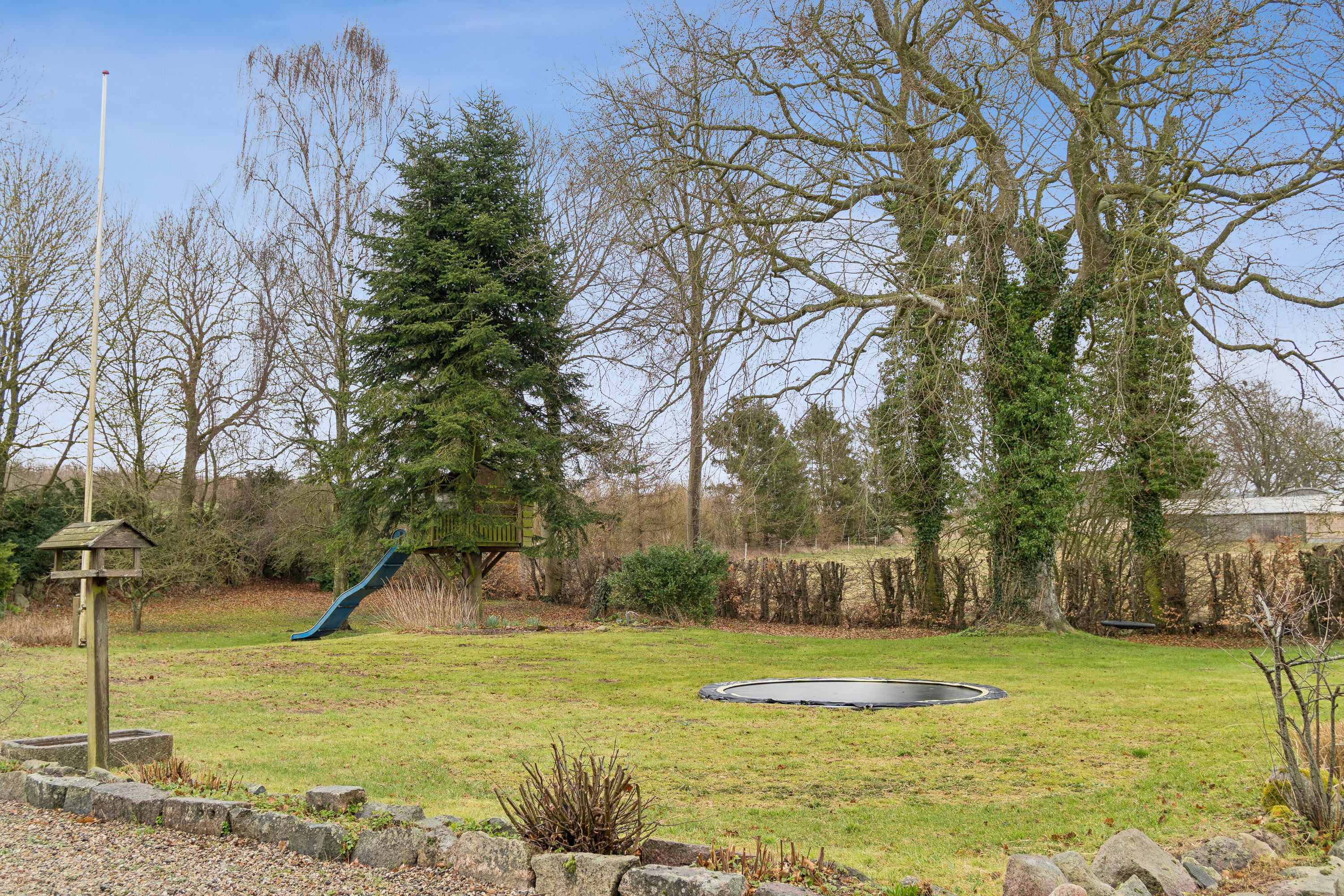 Fremhævet set fra haven billede i fuldskærmstilstand. Billede af Vesterskovvej 1, Årslev Mark, 5792 Årslev