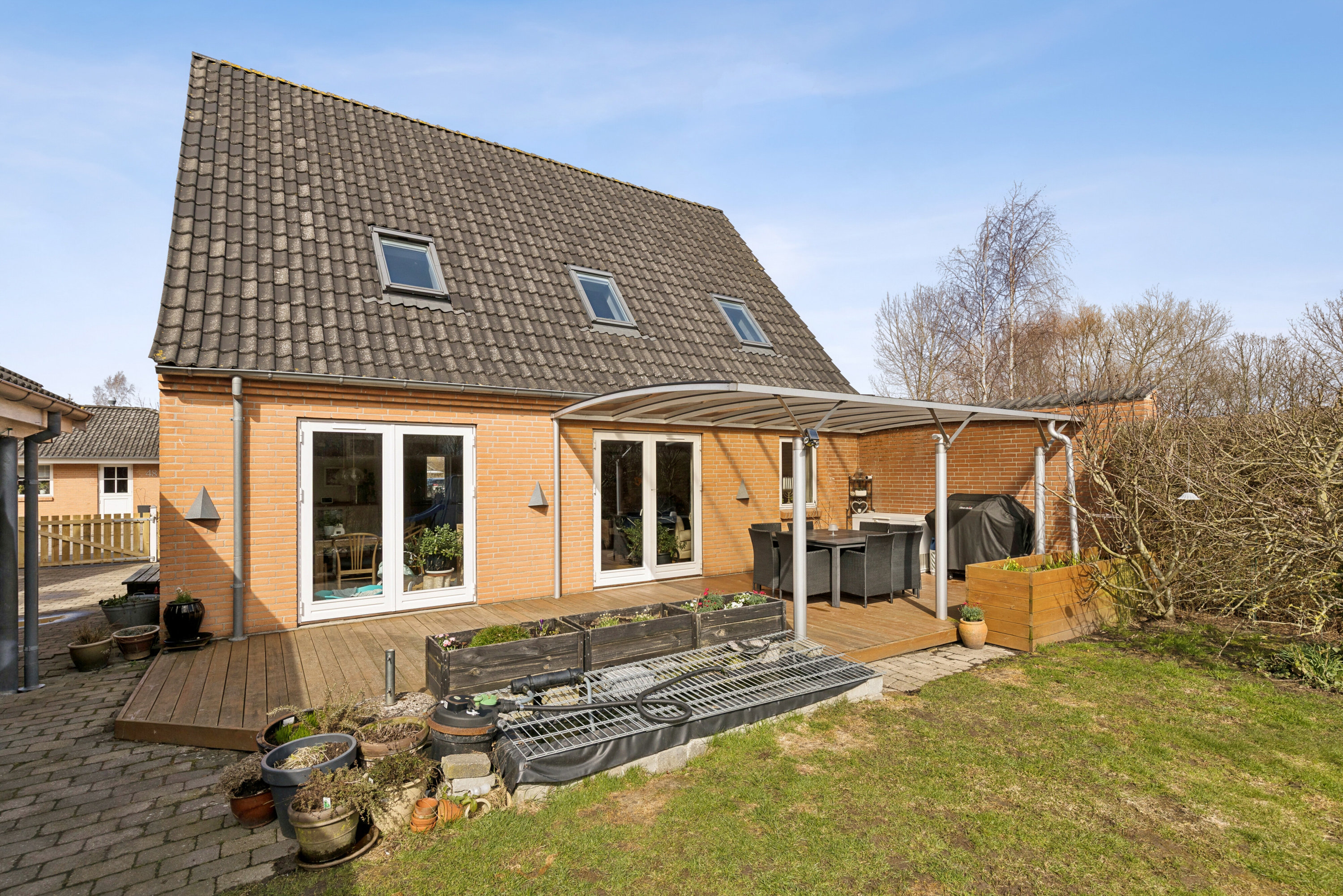 Fremhævet set fra haven billede i fuldskærmstilstand. Billede af Plantevej 49, Appenæs, 4700 Næstved