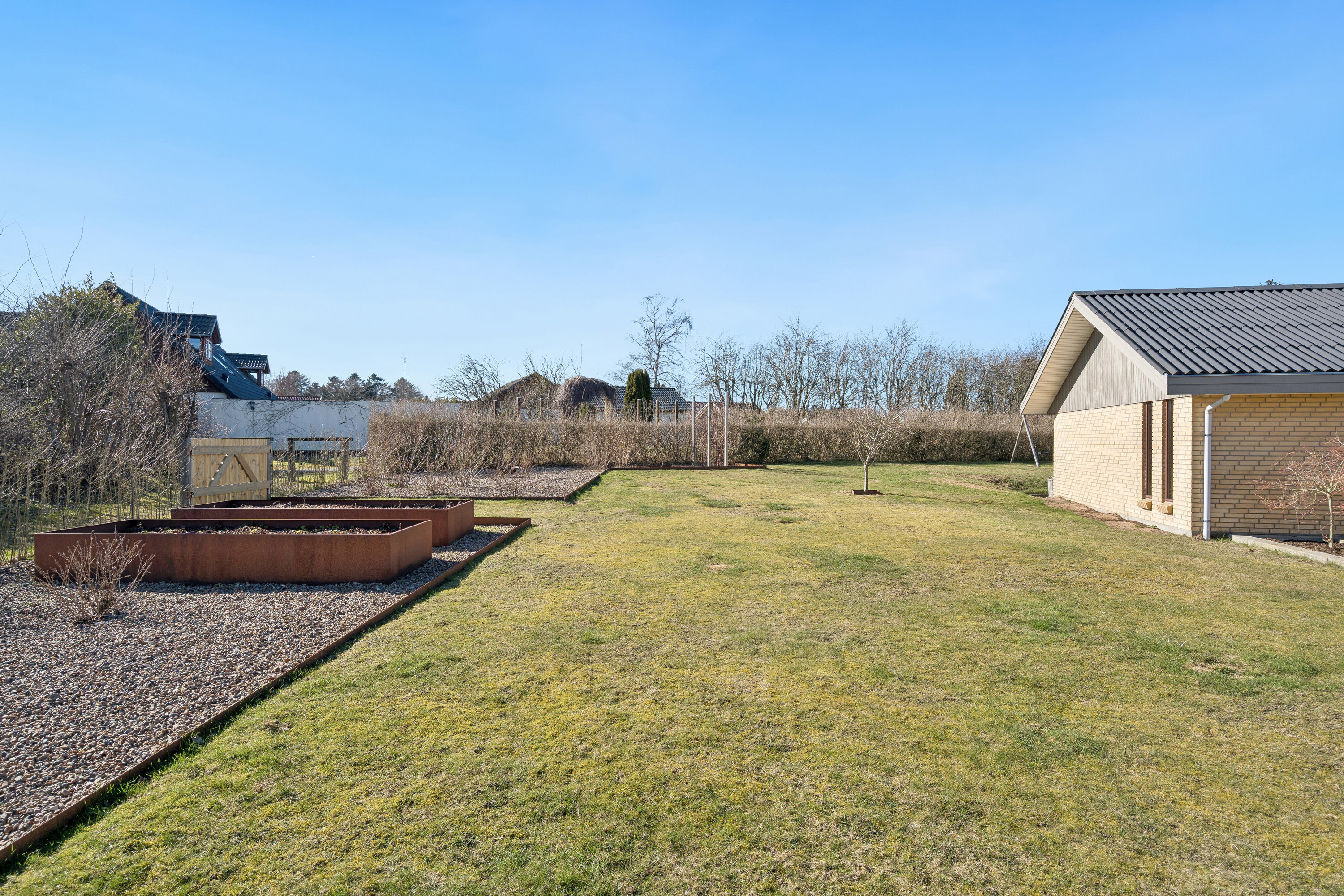 Fremhævet set fra haven billede i fuldskærmstilstand. Billede af Frejasvej 21, 9870 Sindal