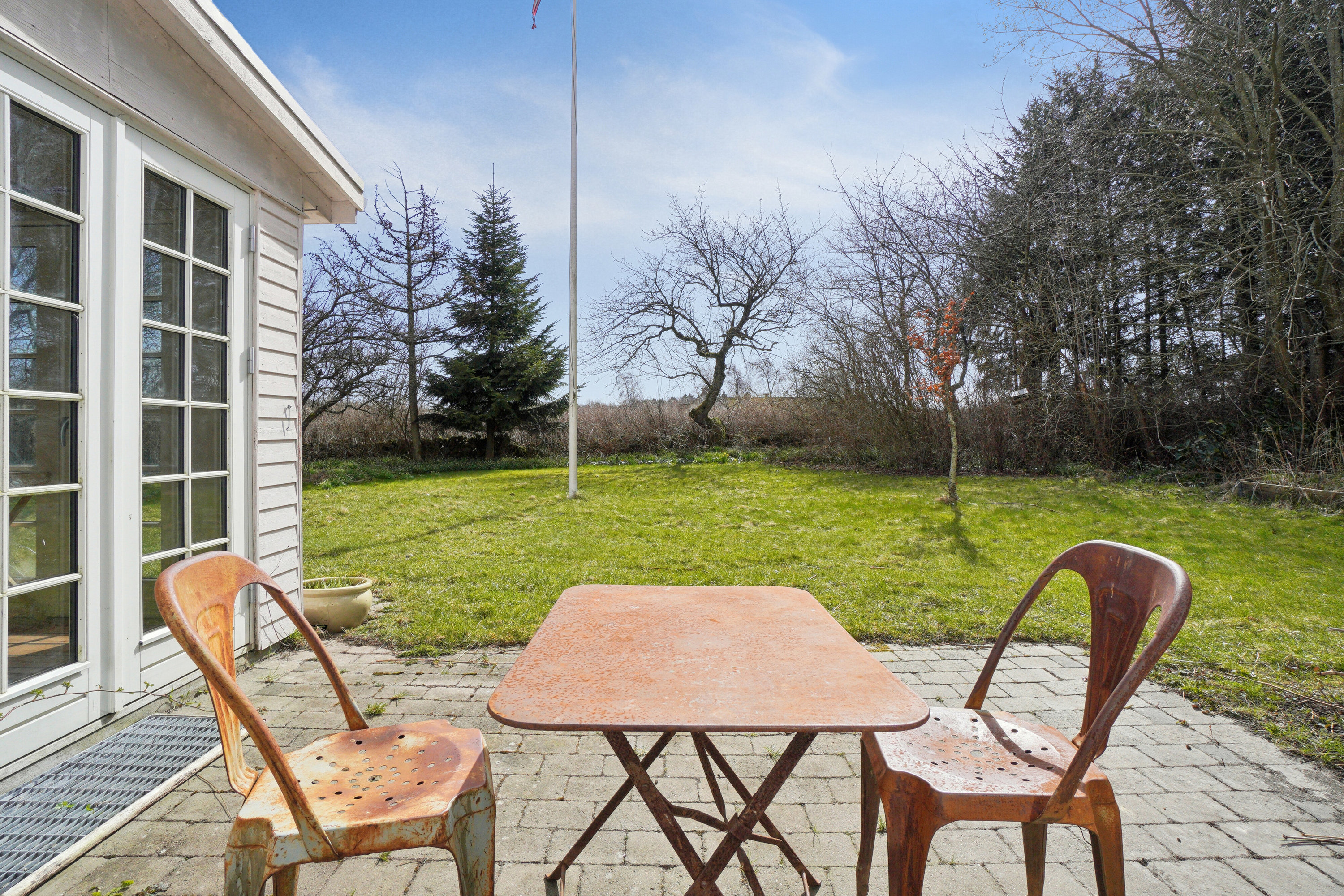 Fremhævet terrasse billede i fuldskærmstilstand. Billede af Flæskedalsvej 1, Østerlars, 3760 Gudhjem