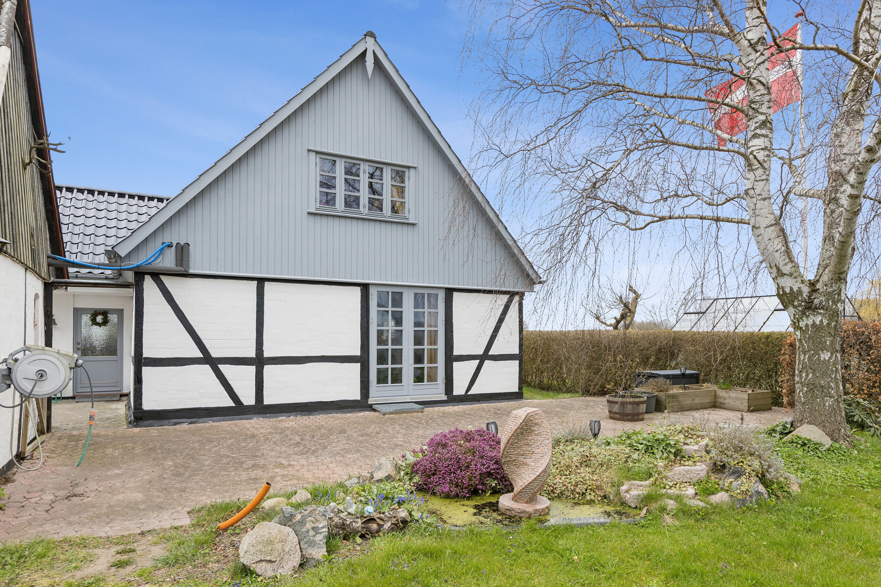 Fremhævet set fra haven billede i fuldskærmstilstand. Billede af Nordhøjvej 48, Smerup, 4653 Karise