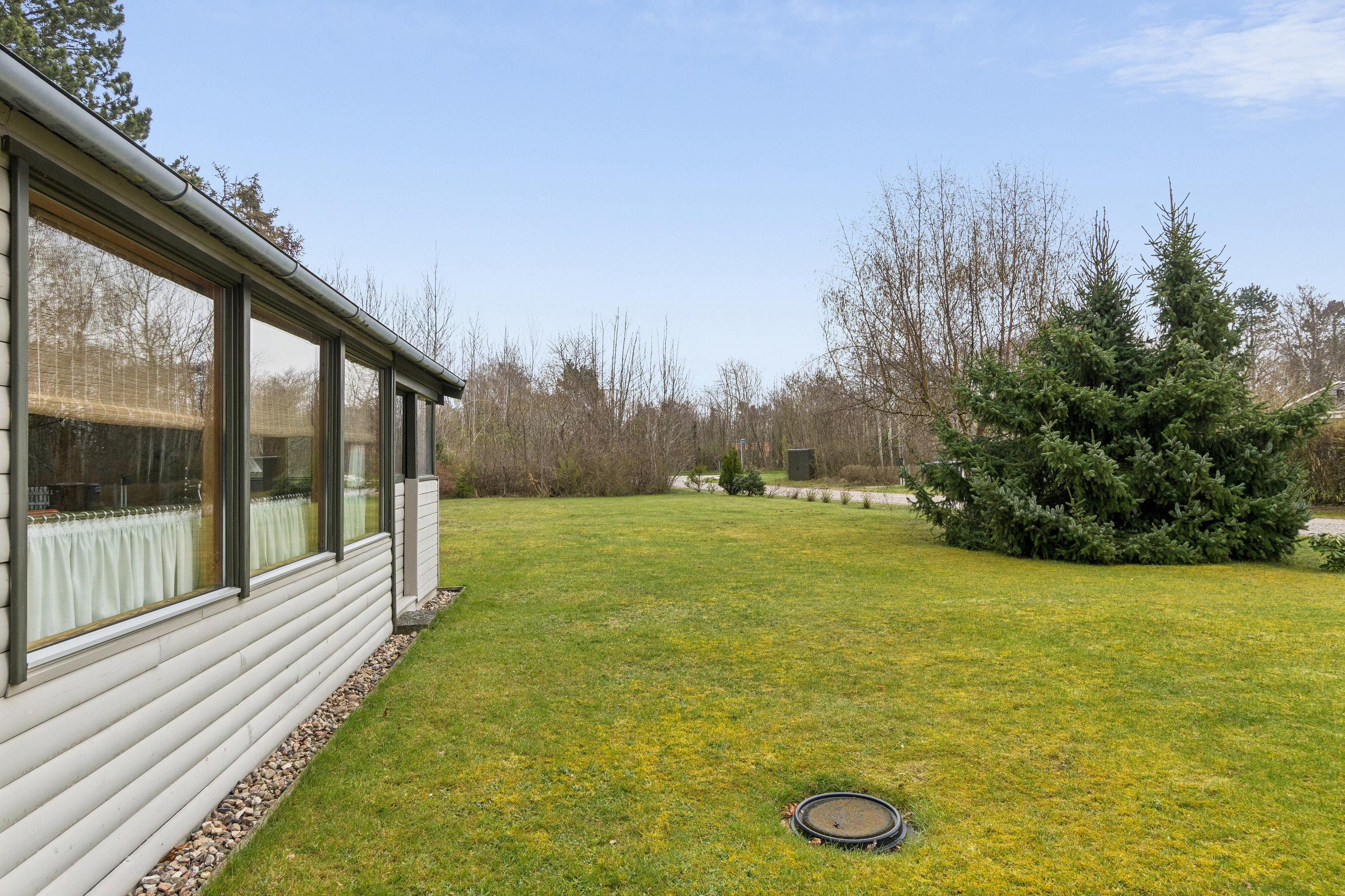 Fremhævet set fra haven billede i fuldskærmstilstand. Billede af Hvidtjørnevej 13, Kaldred, 4593 Eskebjerg