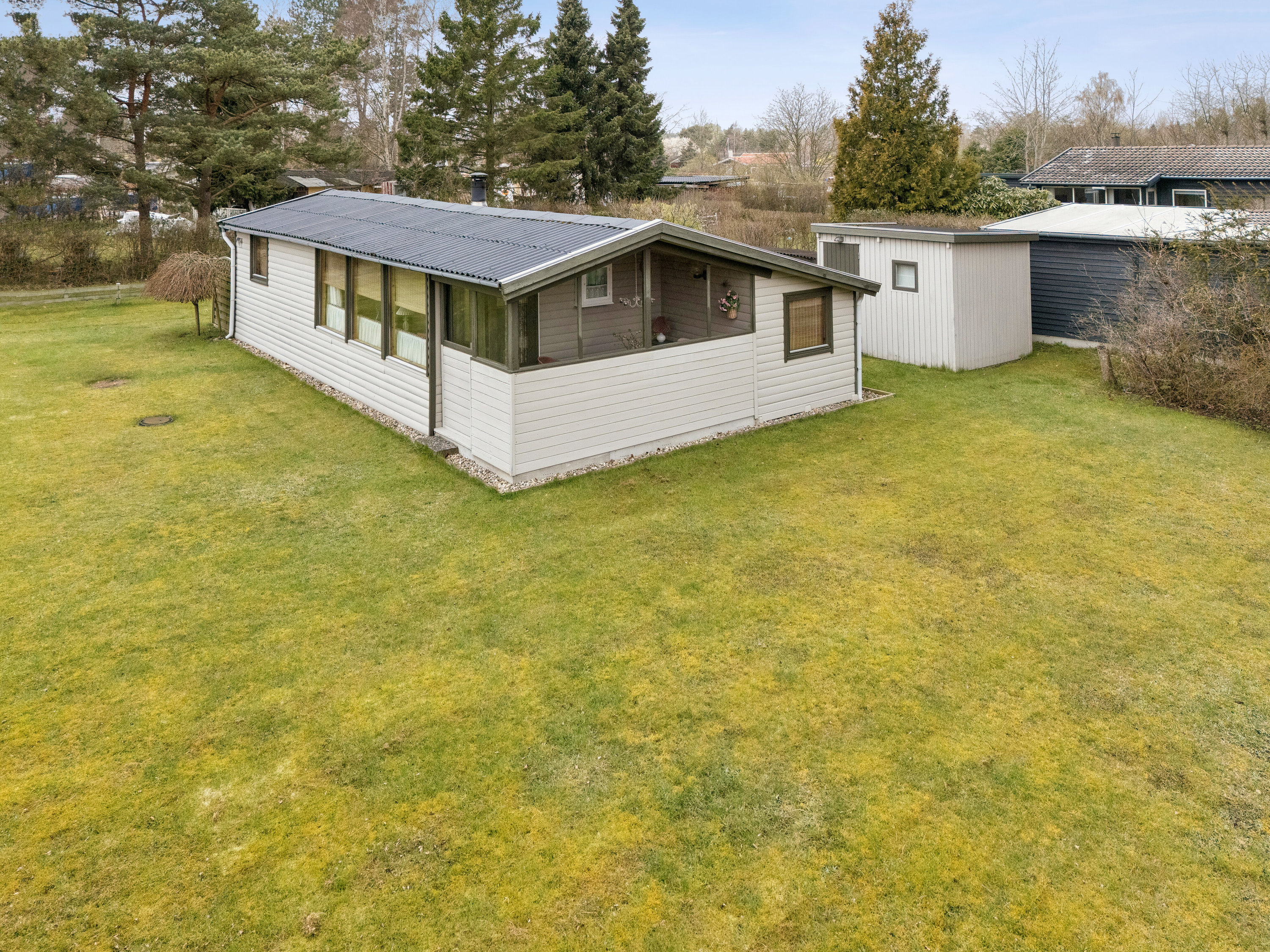 Fremhævet set fra haven billede i fuldskærmstilstand. Billede af Hvidtjørnevej 13, Kaldred, 4593 Eskebjerg