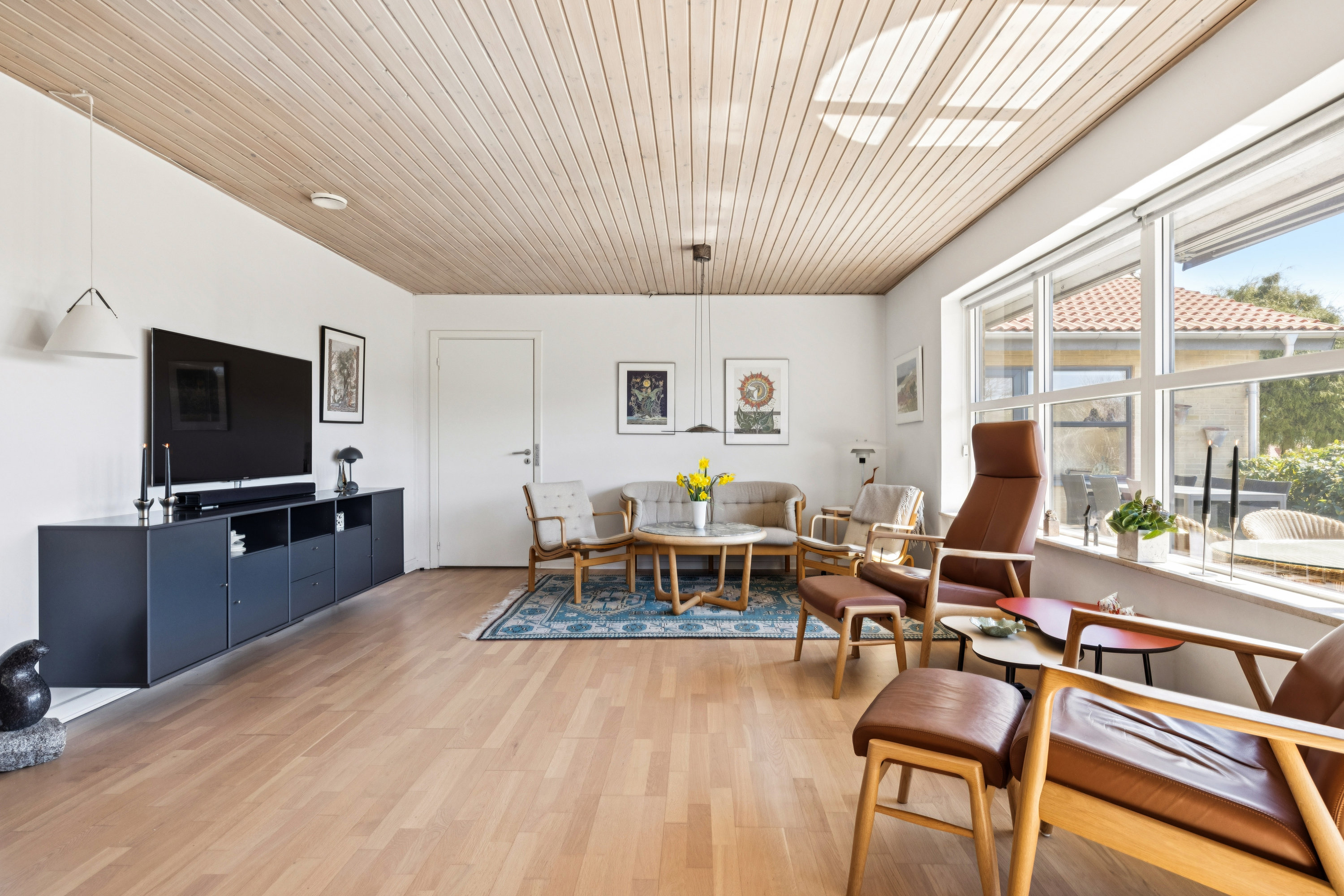 Fremhævet stue billede i fuldskærmstilstand. Billede af Rosenhøjvej 22, Ugelbølle, 8410 Rønde