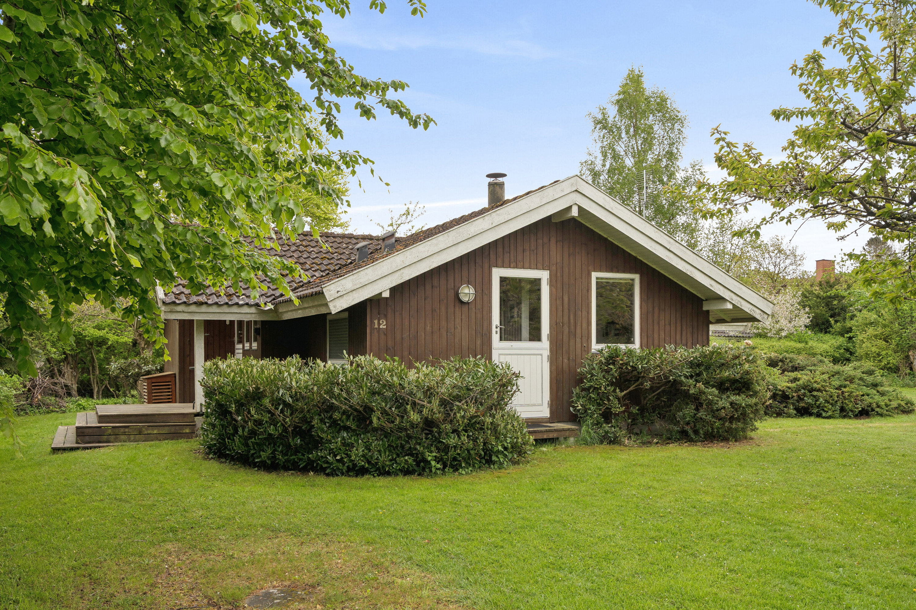 Fremhævet set fra haven billede i fuldskærmstilstand. Billede af Rudolf Martinsens Vej 12, 4654 Faxe Ladeplads