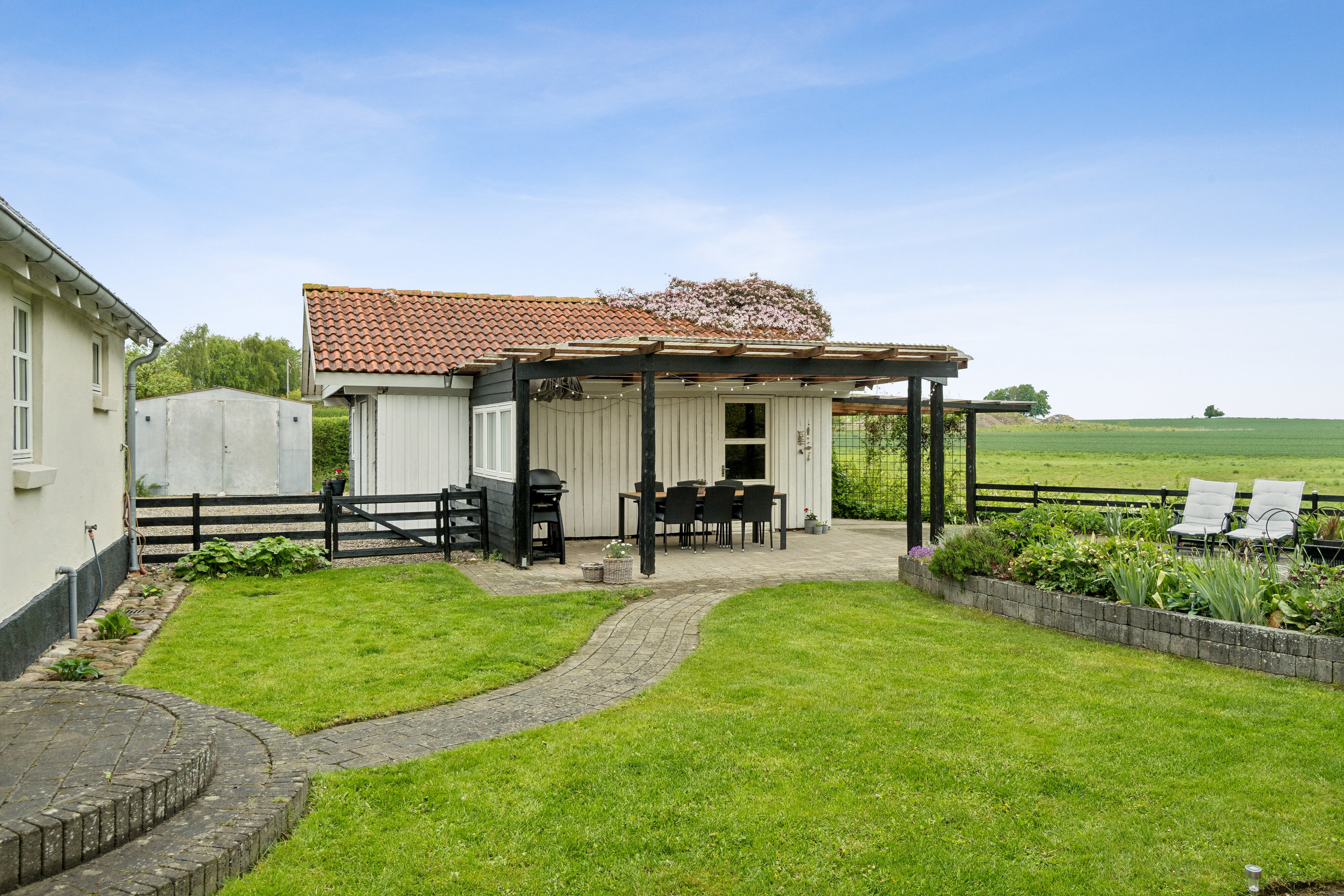 Fremhævet set fra haven billede i fuldskærmstilstand. Billede af Grønhøjvej 7, Kirke Stillinge, 4200 Slagelse