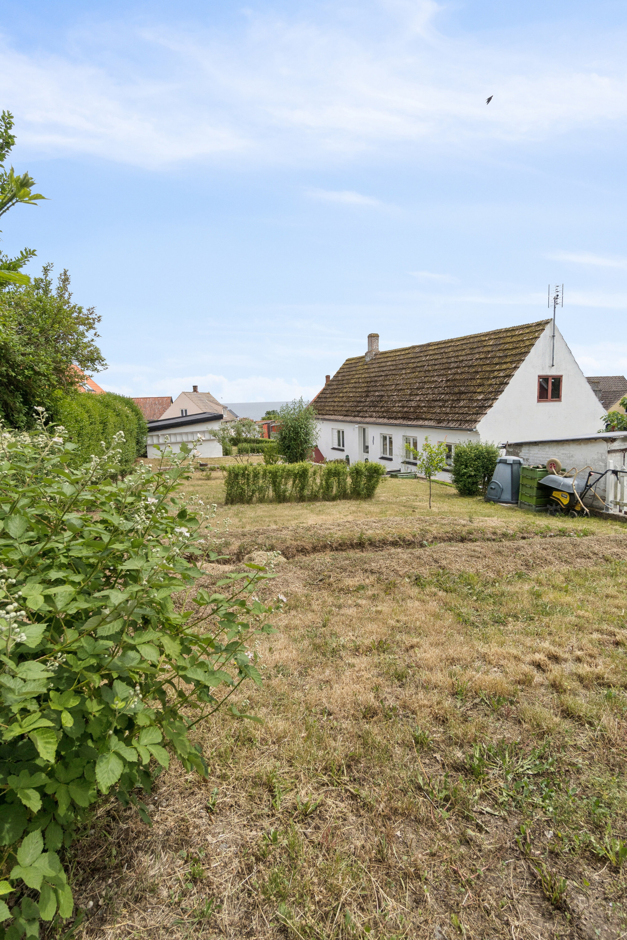 Fremhævet set fra haven billede i fuldskærmstilstand. Billede af Norre Næbbe 6, Aarsdale, 3740 Svaneke