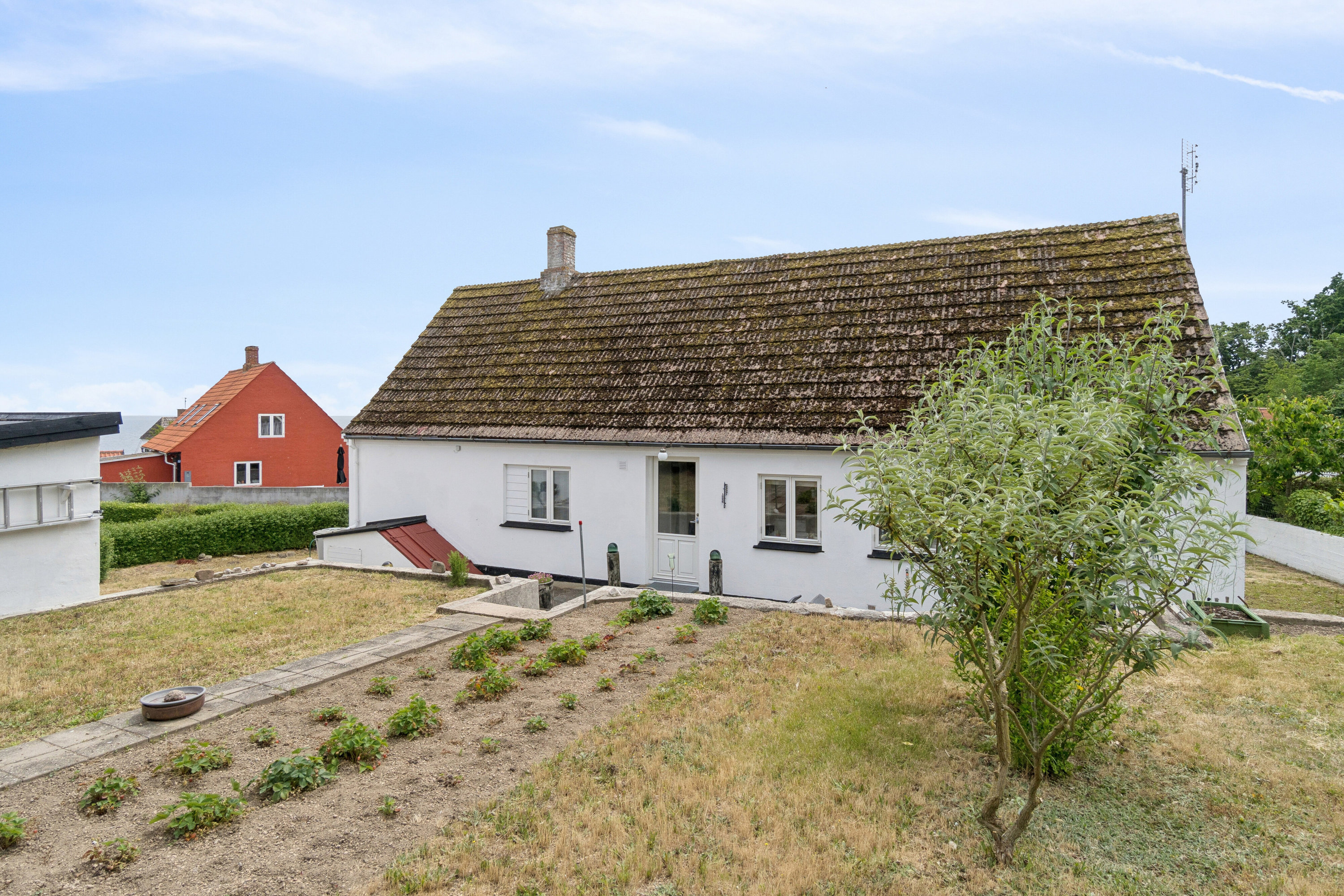 Fremhævet set fra haven billede i fuldskærmstilstand. Billede af Norre Næbbe 6, Aarsdale, 3740 Svaneke
