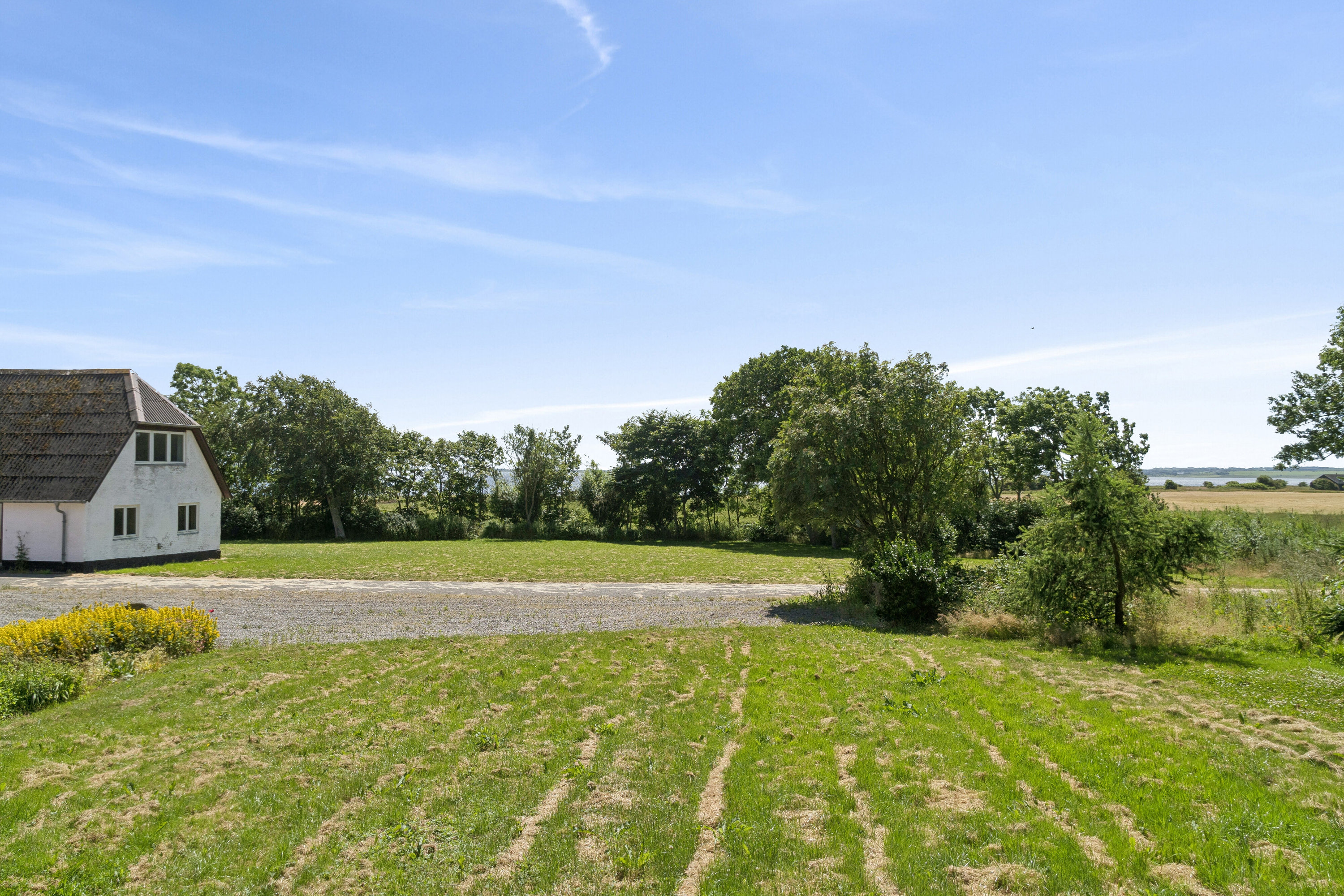 Fremhævet set fra haven billede i fuldskærmstilstand. Billede af Gudnæsvej 12, 7755 Bedsted Thy