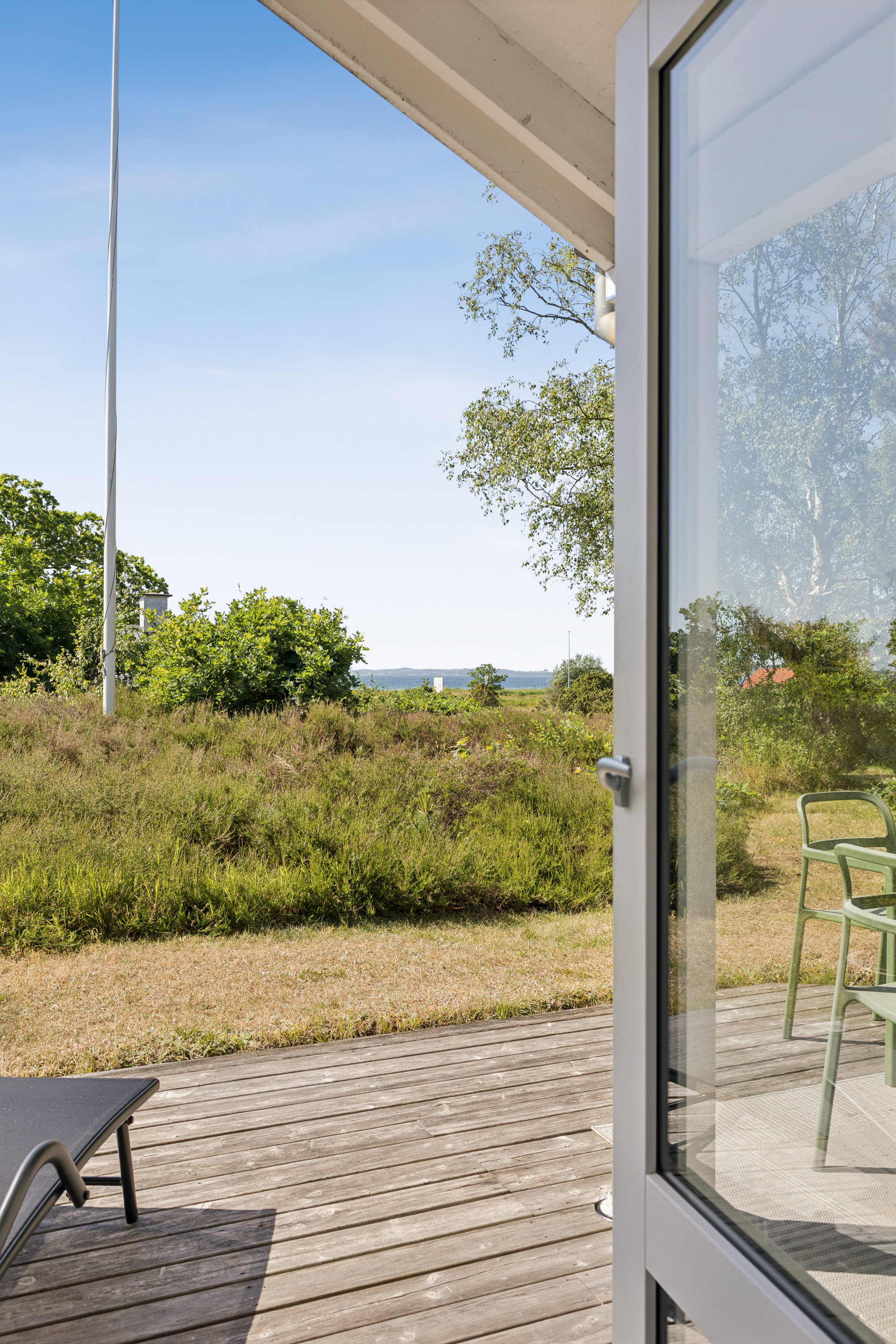 Fremhævet terrasse billede i fuldskærmstilstand. Billede af Nordmandsvej 12, Femmøller Strand, 8400 Ebeltoft