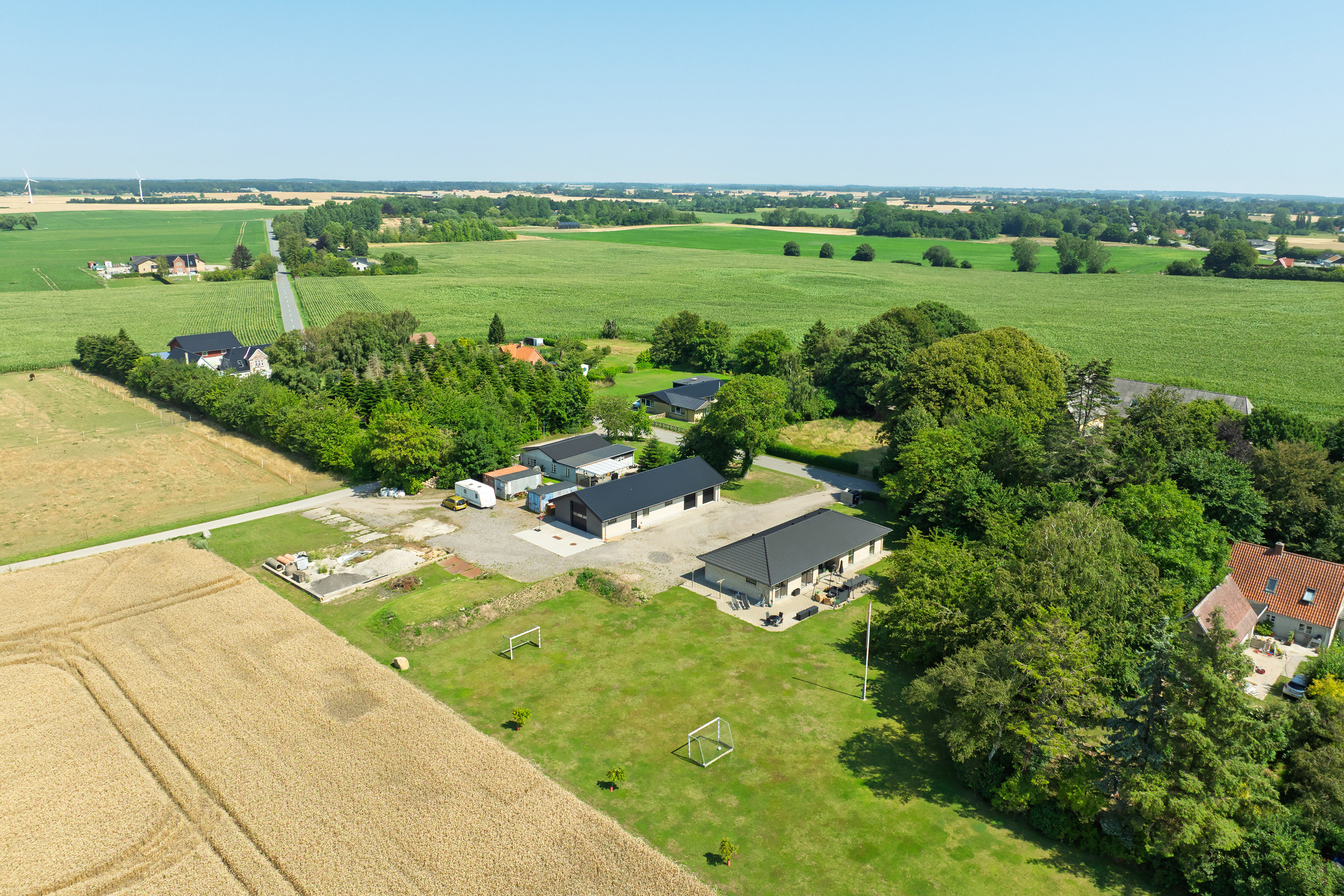 Fremhævet luftfoto billede i fuldskærmstilstand. Billede af Systofte Bygade 31, Systofte, 4800 Nykøbing F