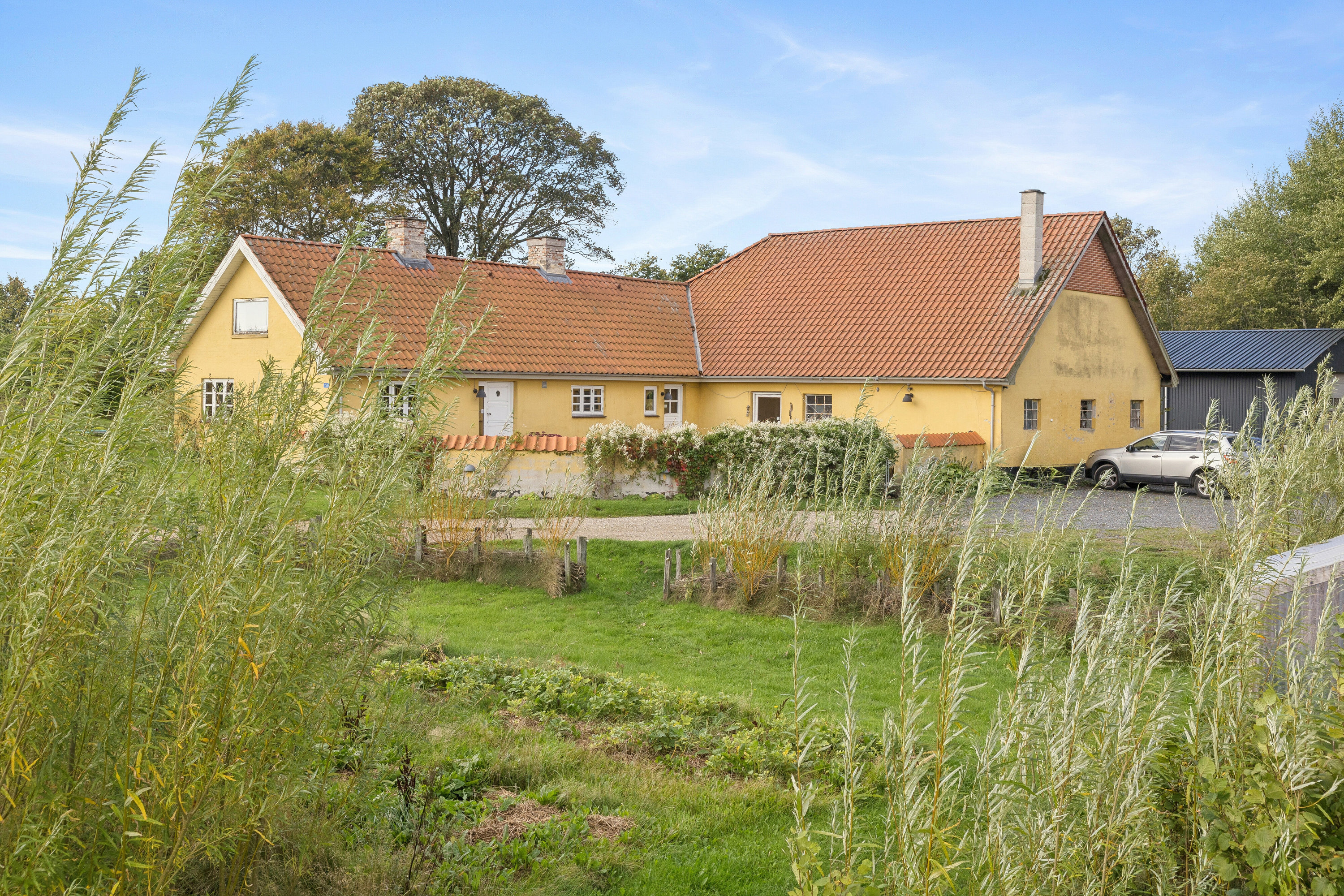 Fremhævet set fra haven billede i fuldskærmstilstand. Billede af Kirkemosevej 153, Hørmested, 9870 Sindal