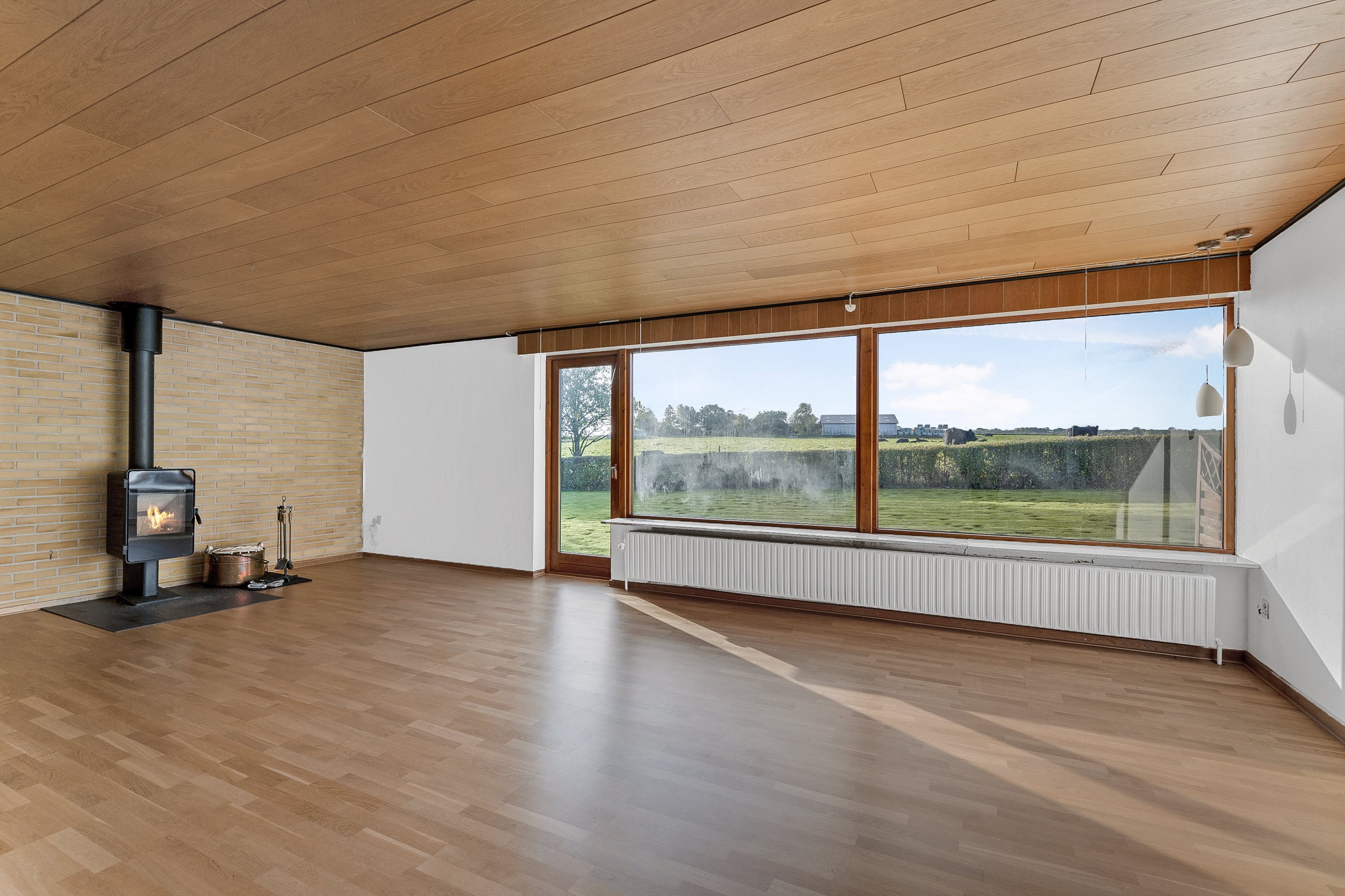 Fremhævet stue billede i fuldskærmstilstand. Billede af Soltoftevej 3, Ø Alling, 8963 Auning