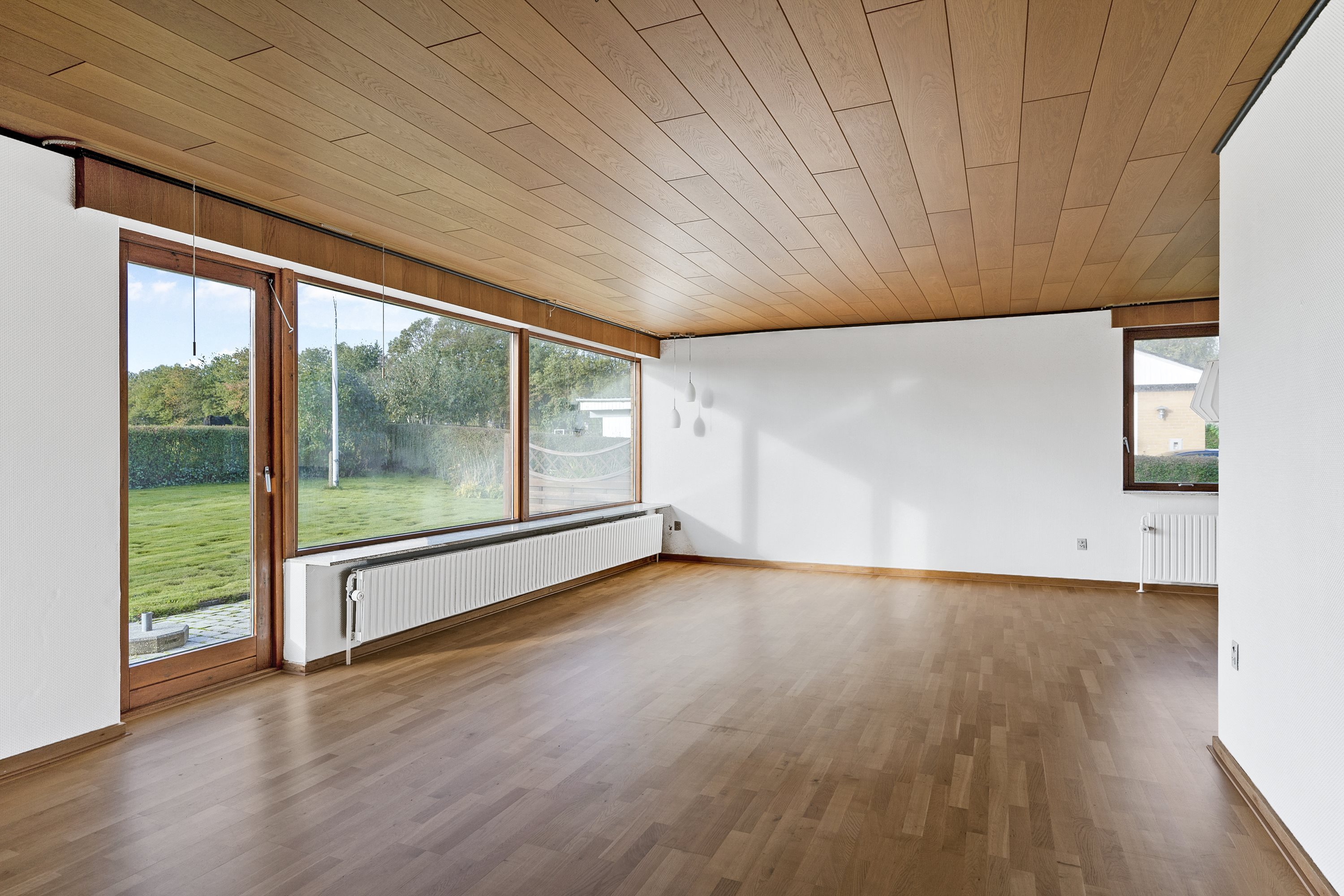 Fremhævet stue billede i fuldskærmstilstand. Billede af Soltoftevej 3, Ø Alling, 8963 Auning