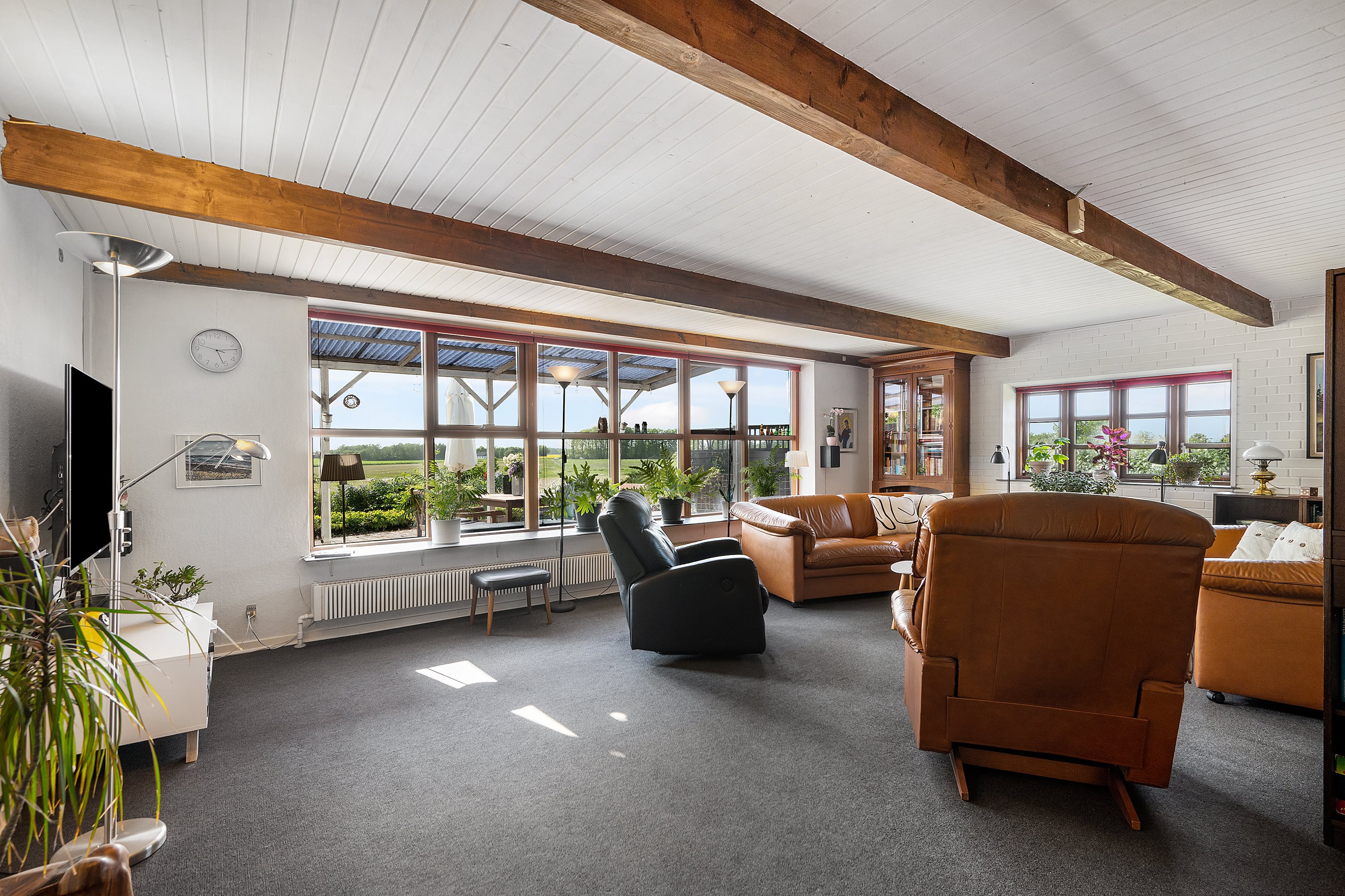 Fremhævet stue billede i fuldskærmstilstand. Billede af Mamrelundsvej 2, Vejlby, 8961 Allingåbro