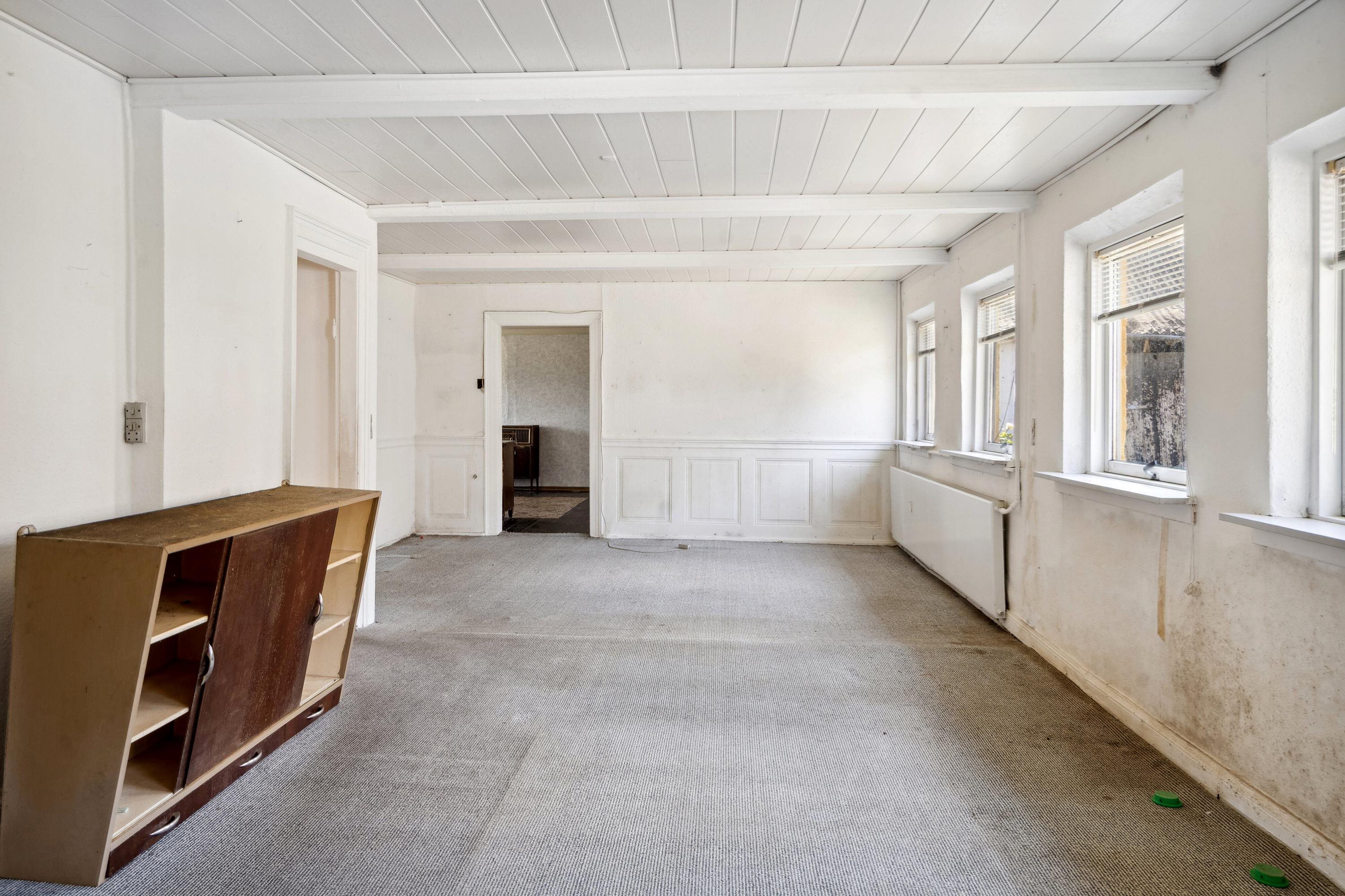 Fremhævet stue billede i fuldskærmstilstand. Billede af Strandbakken 3, Helnæs, 5631 Ebberup